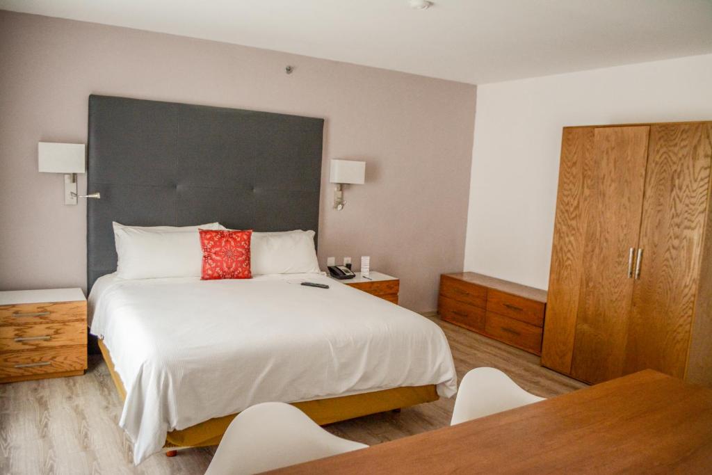 Postel nebo postele na pokoji v ubytování Stain Loft & Suites