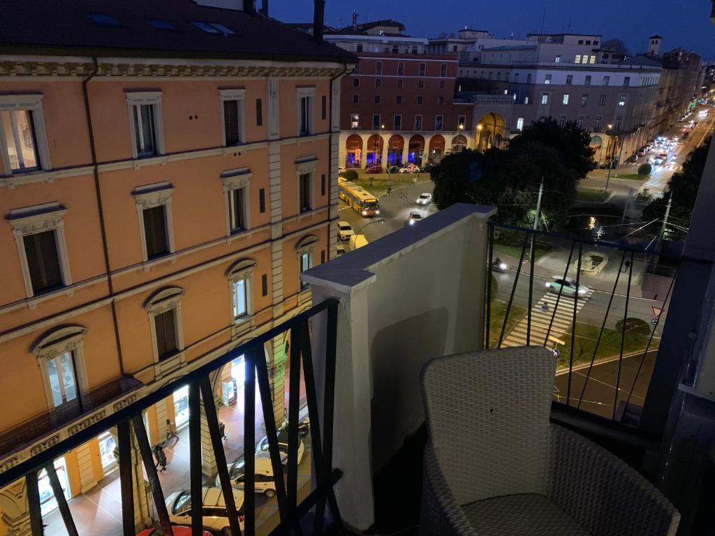 a balcony with a view of a street at night at Stayinbologna 2 in Bologna