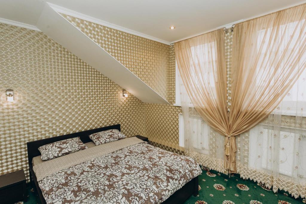 Кровать или кровати в номере City Center Apart-Hotel
