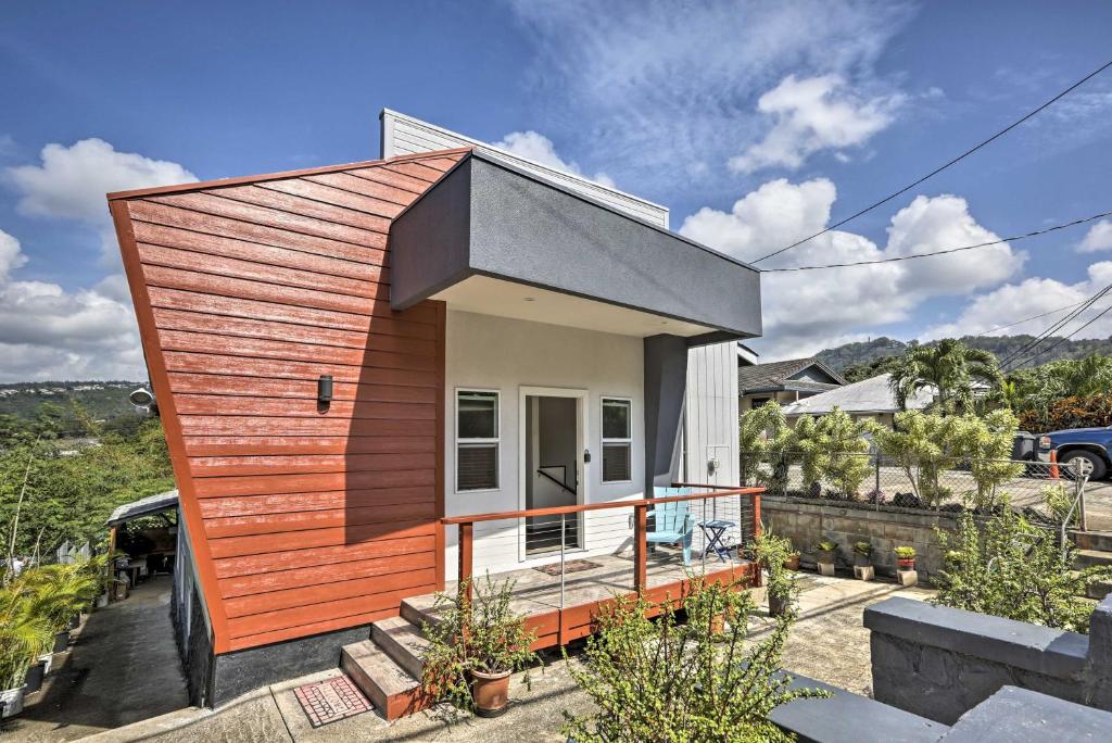 a small house with a wooden exterior at Remodeled Honolulu Apartment with Courtyard Downtown in Honolulu