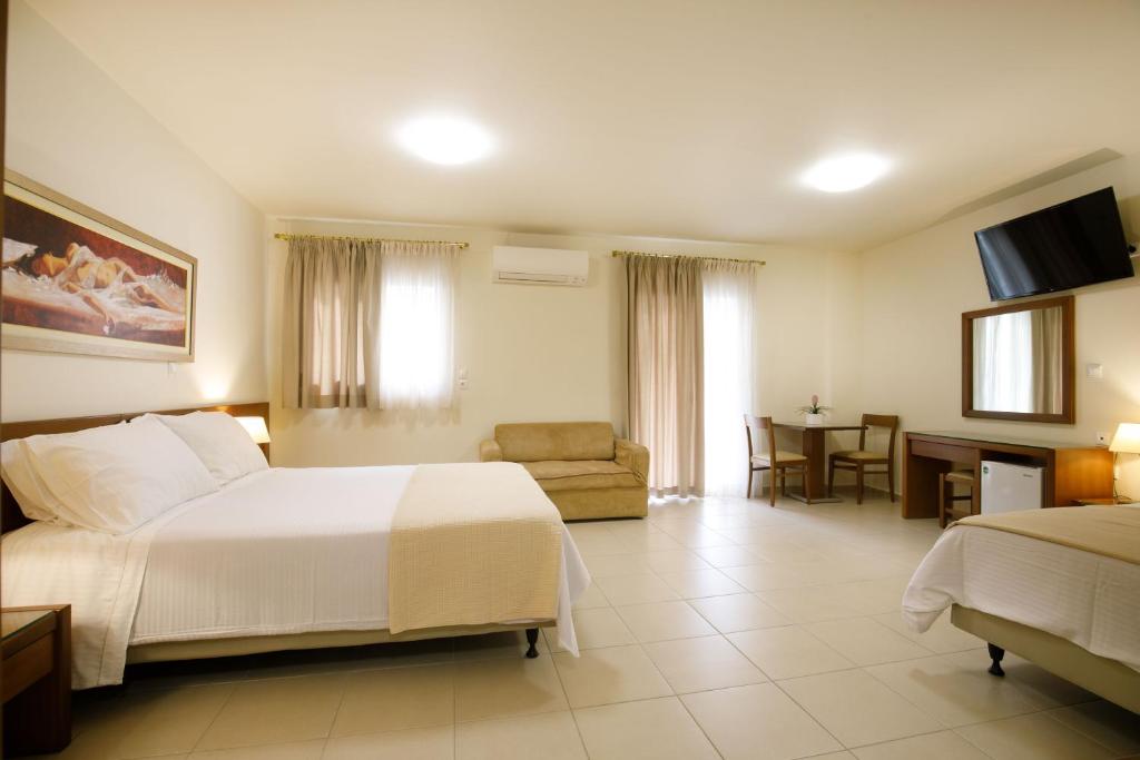Postel nebo postele na pokoji v ubytování Hotel ΑΤΗΙΝΑ