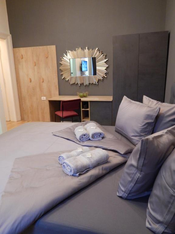 Posteľ alebo postele v izbe v ubytovaní Gold Rooms and Suite