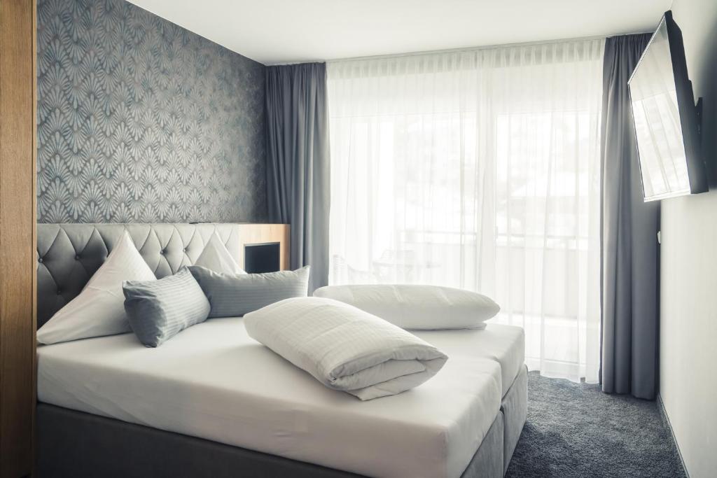 Posteľ alebo postele v izbe v ubytovaní Panorama Residence Mösern