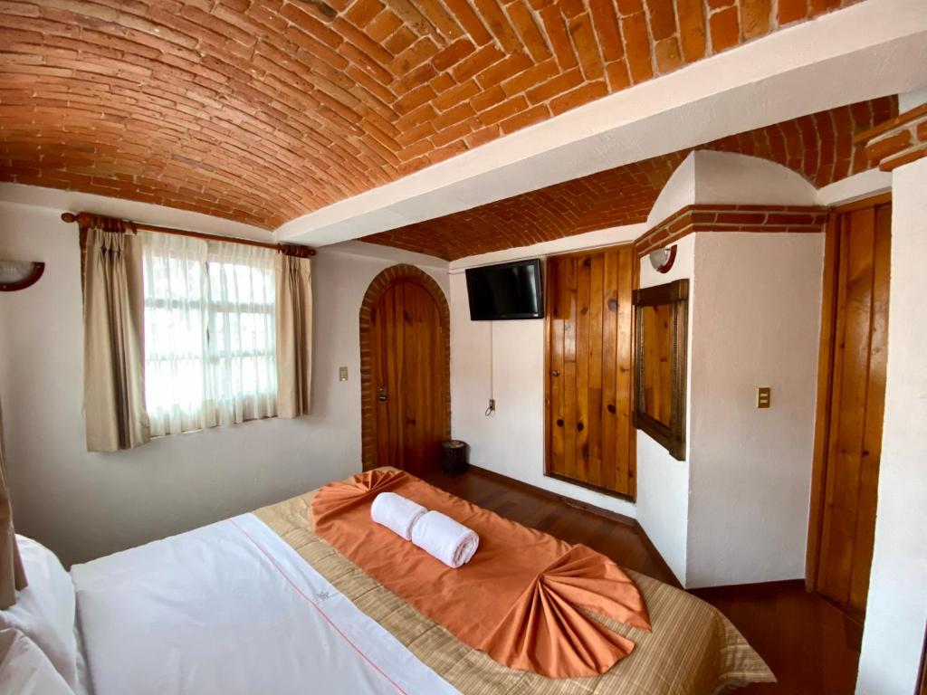 Postel nebo postele na pokoji v ubytování Suites Paraiso Tequis