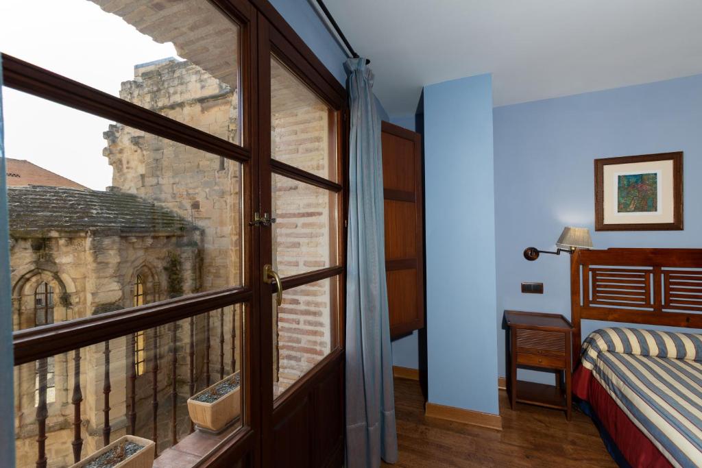 Postel nebo postele na pokoji v ubytování Palacio de Pujadas