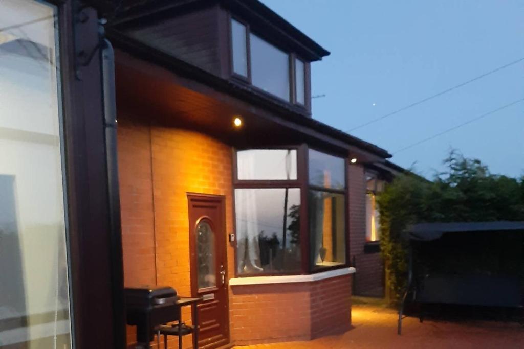 a small house with a window on the side of it at Sunny Lynn in Oldham