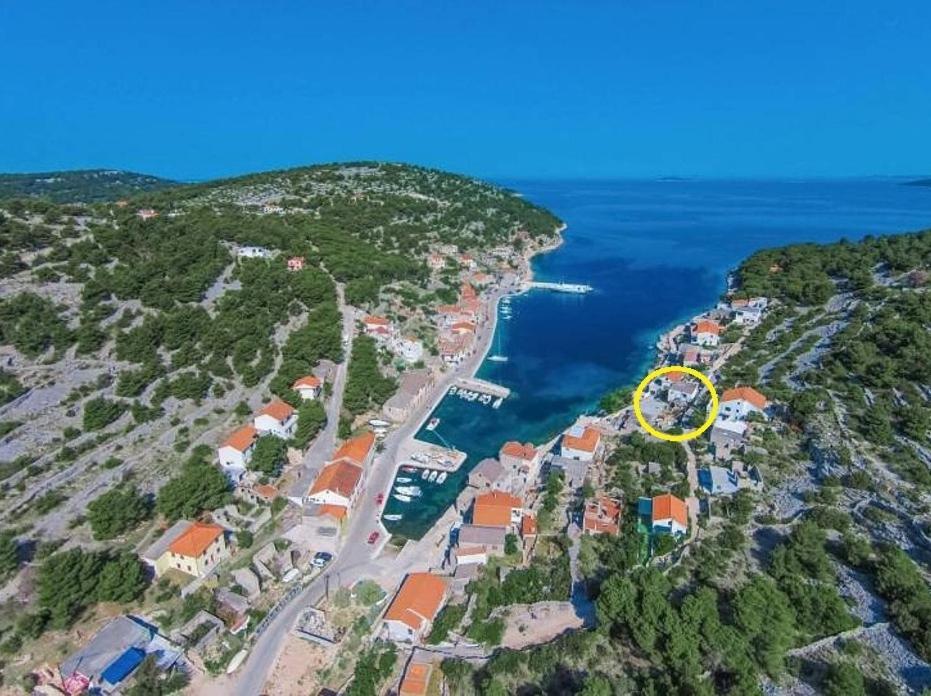 an aerial view of an island with a yellow circle at Apartment Katija - close to the sea in Žirje