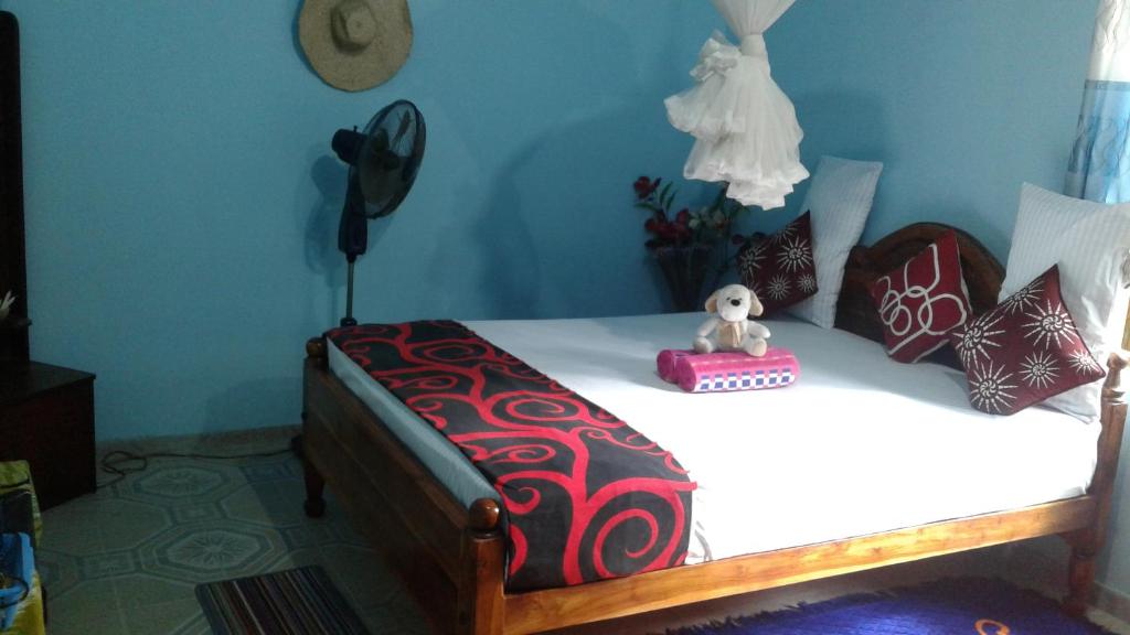 Postel nebo postele na pokoji v ubytování Flower Inn