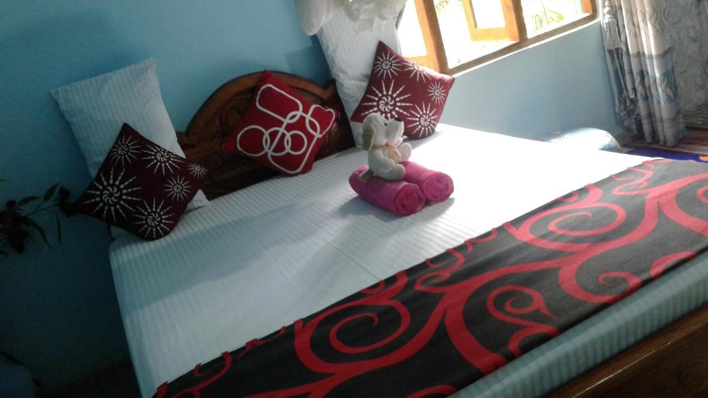 Postel nebo postele na pokoji v ubytování Flower Inn