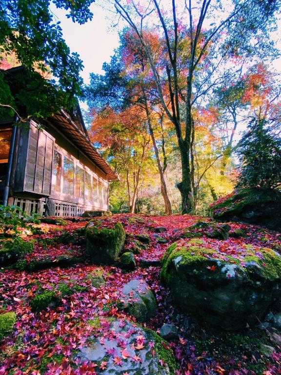 a painting of a house with flowers in front of it at Tsukihitei in Nara
