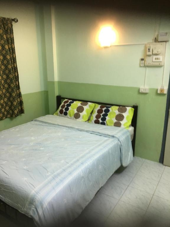 Postel nebo postele na pokoji v ubytování Baan Suan Resort2345