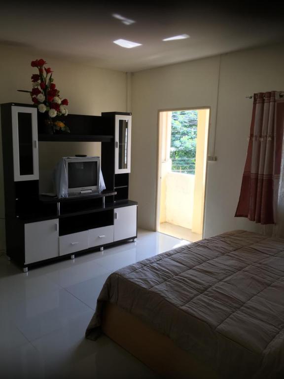 Postel nebo postele na pokoji v ubytování Baan Suan Resort2345
