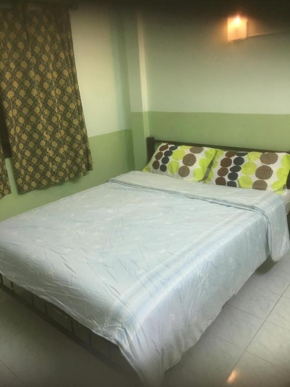 Postel nebo postele na pokoji v ubytování Baan Suan Resort2345