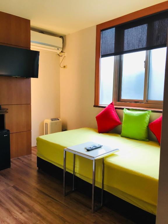 Postel nebo postele na pokoji v ubytování Chiu Chunt Dint B&B