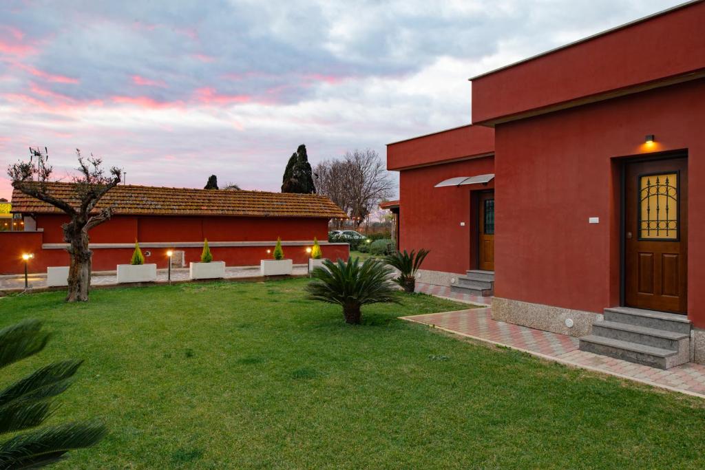 Vonkajšia záhrada v ubytovaní Domus Porto Di Traiano Resort