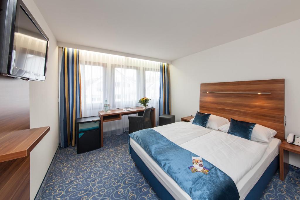 Postel nebo postele na pokoji v ubytování Hotel Strohgäu