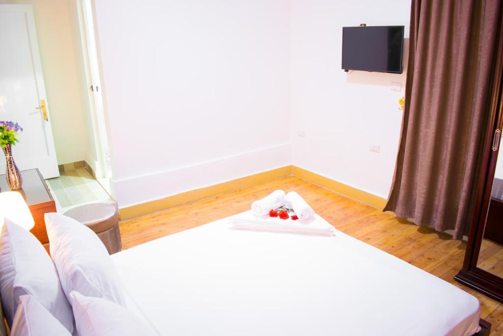 Postel nebo postele na pokoji v ubytování Golden Palace Hotel