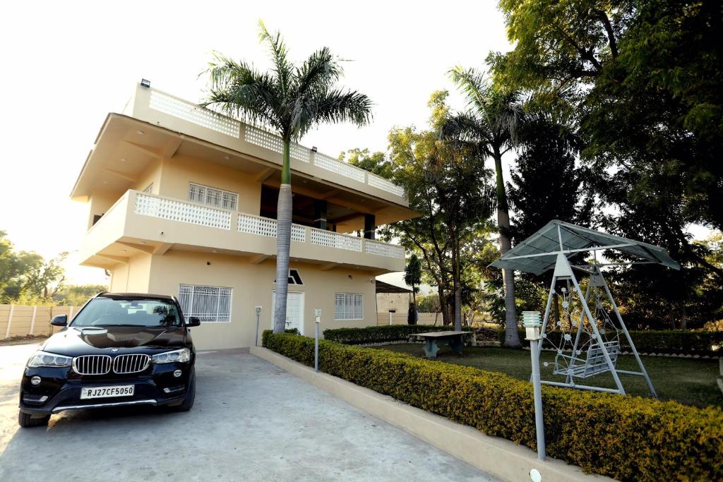 a car parked in front of a house at The Q Villa, Udaipur in Udaipur