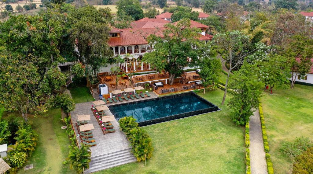 an aerial view of a house with a swimming pool at Sanctum Inle Resort in Nyaungshwe Township