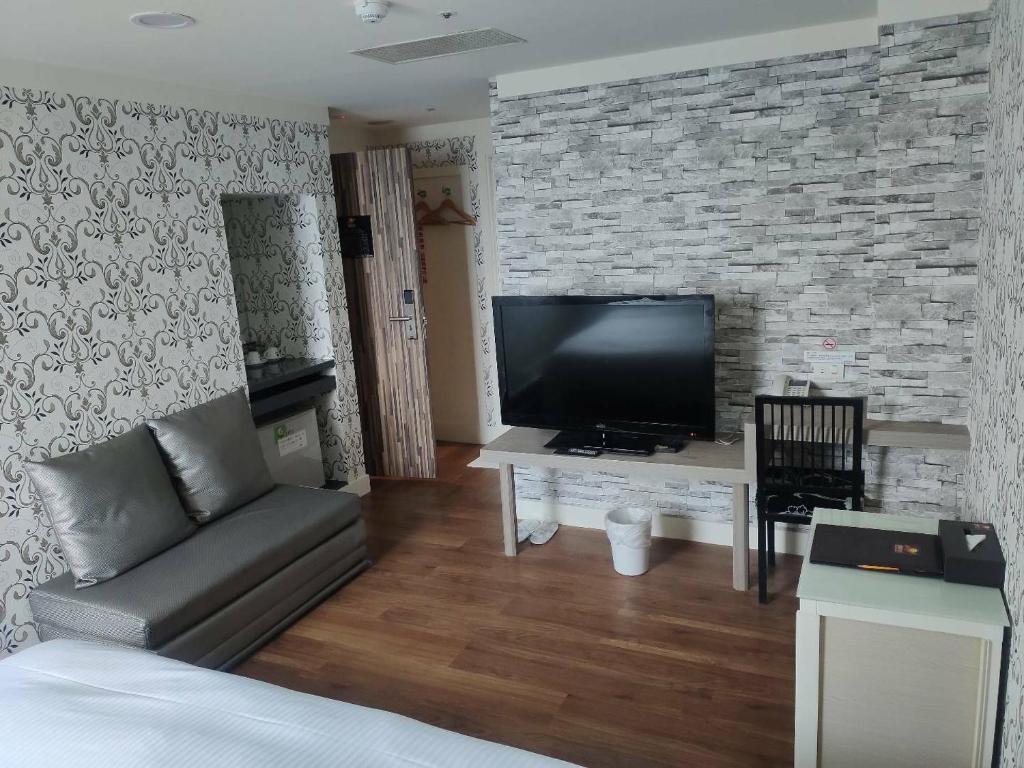 TV a/nebo společenská místnost v ubytování HengChang Business Hotel