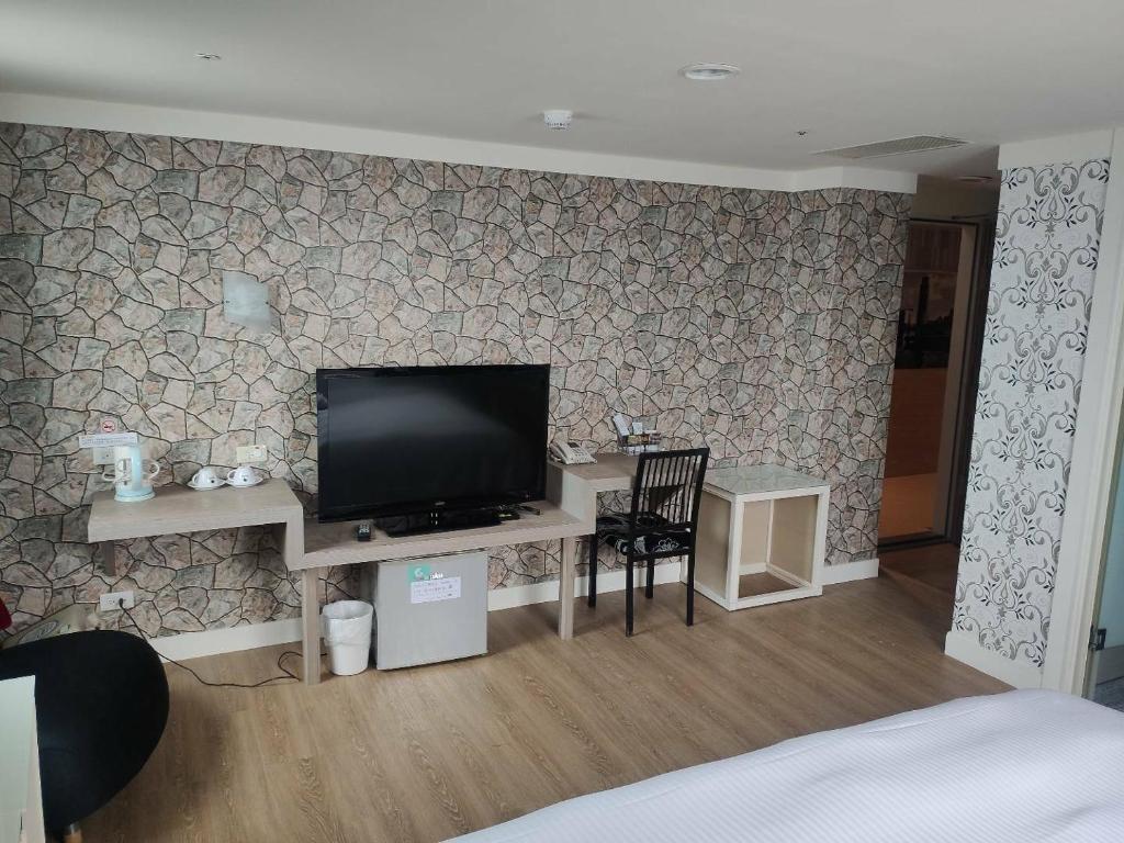 TV a/nebo společenská místnost v ubytování HengChang Business Hotel