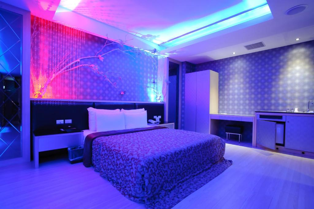 Postel nebo postele na pokoji v ubytování Zhen 13 Villa Motel