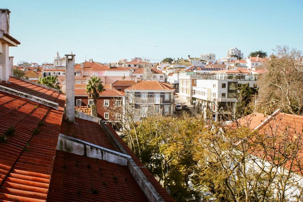 a view of a city from the roofs of houses at Cascais City & Beach Hotel in Cascais
