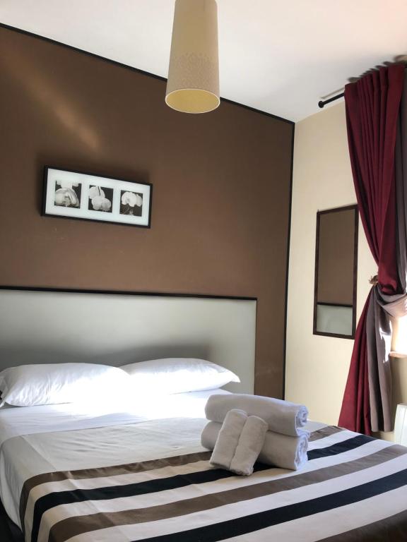 Postel nebo postele na pokoji v ubytování Hotel Casale dei Massimi