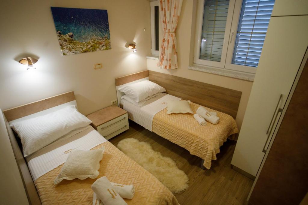Posteľ alebo postele v izbe v ubytovaní Apartment Centrum