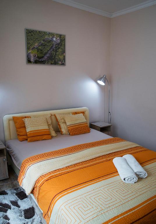 Posteľ alebo postele v izbe v ubytovaní Harmónia Belvárosi Apartmanok