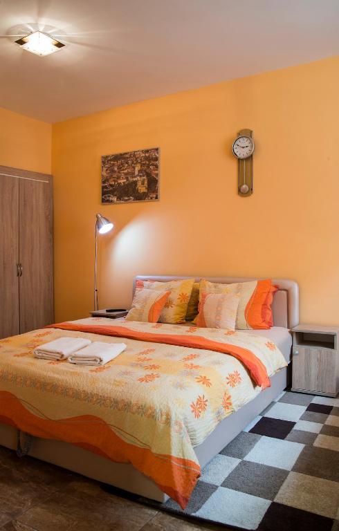 Posteľ alebo postele v izbe v ubytovaní Harmónia Belvárosi Apartmanok
