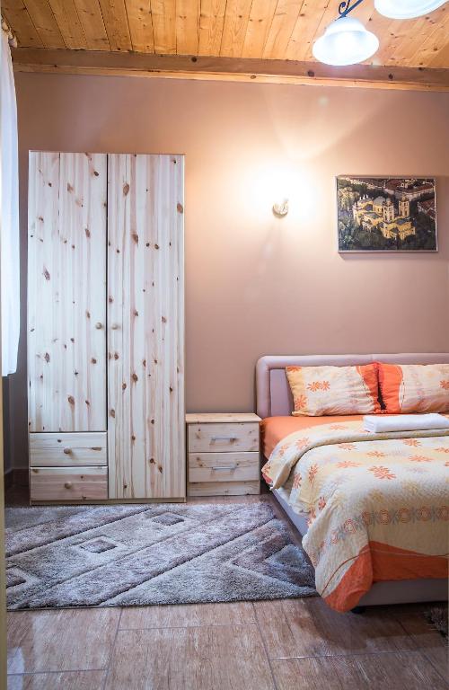 Posteľ alebo postele v izbe v ubytovaní Harmónia Belvárosi Apartmanok