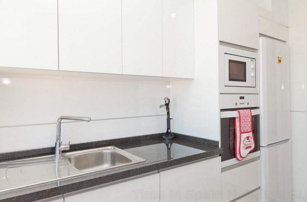 Kuchyň nebo kuchyňský kout v ubytování Apartment LARADA