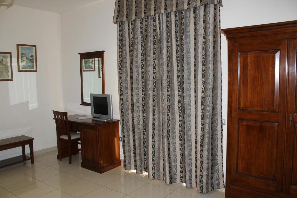 TV a/nebo společenská místnost v ubytování Hotel Domus