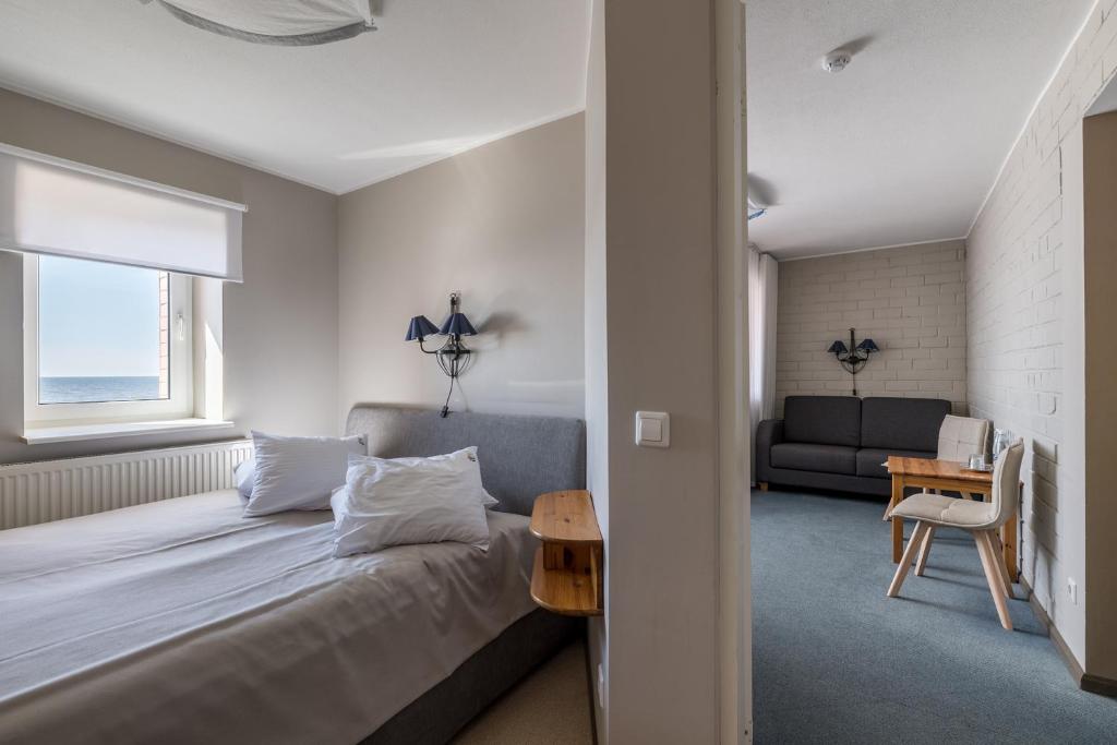 Postel nebo postele na pokoji v ubytování Lepanina Hotell