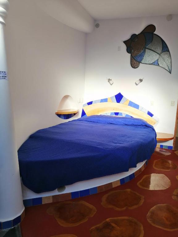 Postel nebo postele na pokoji v ubytování Hostal Las Olas