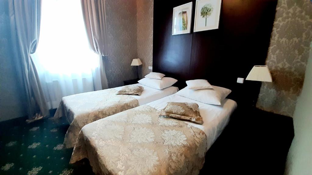 Posteľ alebo postele v izbe v ubytovaní Villa Tradycja