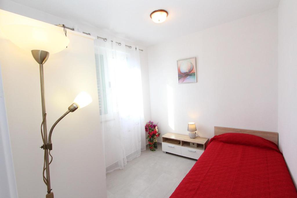 Łóżko lub łóżka w pokoju w obiekcie Apartment Stellina