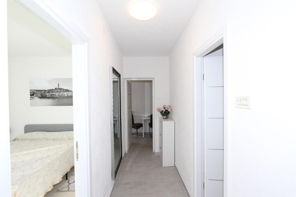 Łóżko lub łóżka w pokoju w obiekcie Apartment Stellina