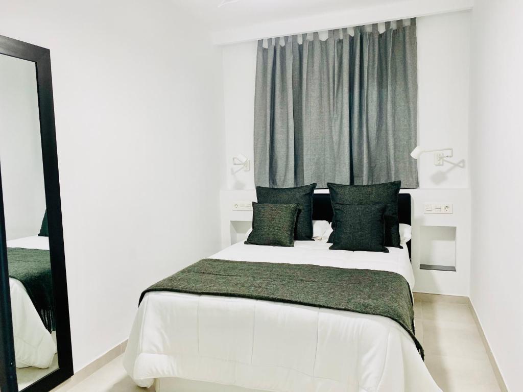 Postel nebo postele na pokoji v ubytování Canaryislandshost l Brisa del Atlántico