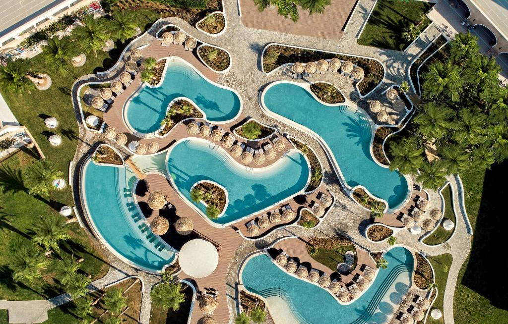 an overhead view of a pool at a resort at Mitsis Norida in Kardamaina
