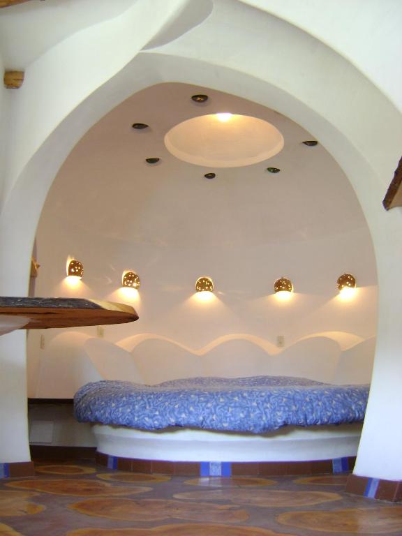 Postel nebo postele na pokoji v ubytování Hostal Las Olas