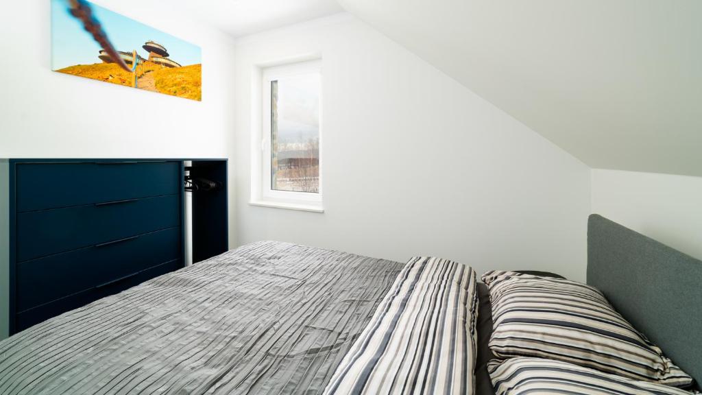 Posteľ alebo postele v izbe v ubytovaní Apartamenty EverySky - Dom Orkana 9