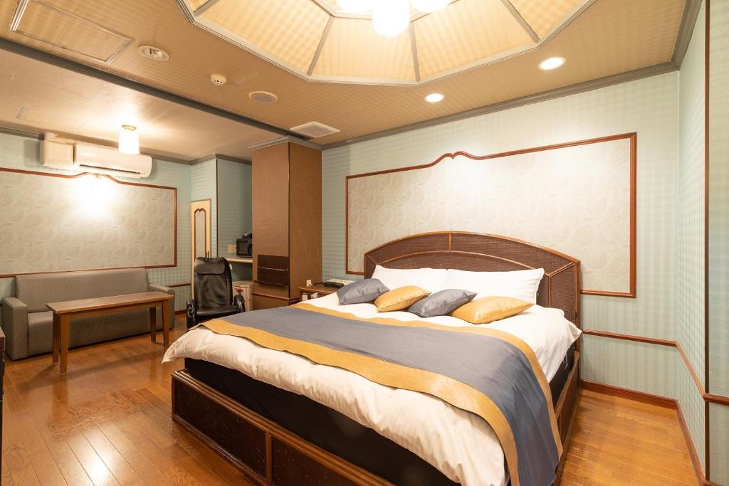 Postel nebo postele na pokoji v ubytování ホテル ドルフィンリゾート 岐阜 -大人専用-