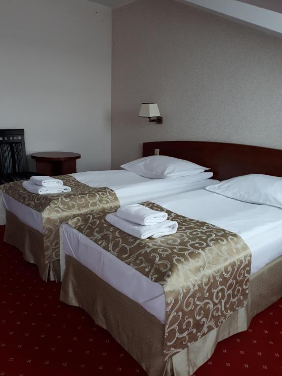 Posteľ alebo postele v izbe v ubytovaní Hotel Stara Gorzelnia