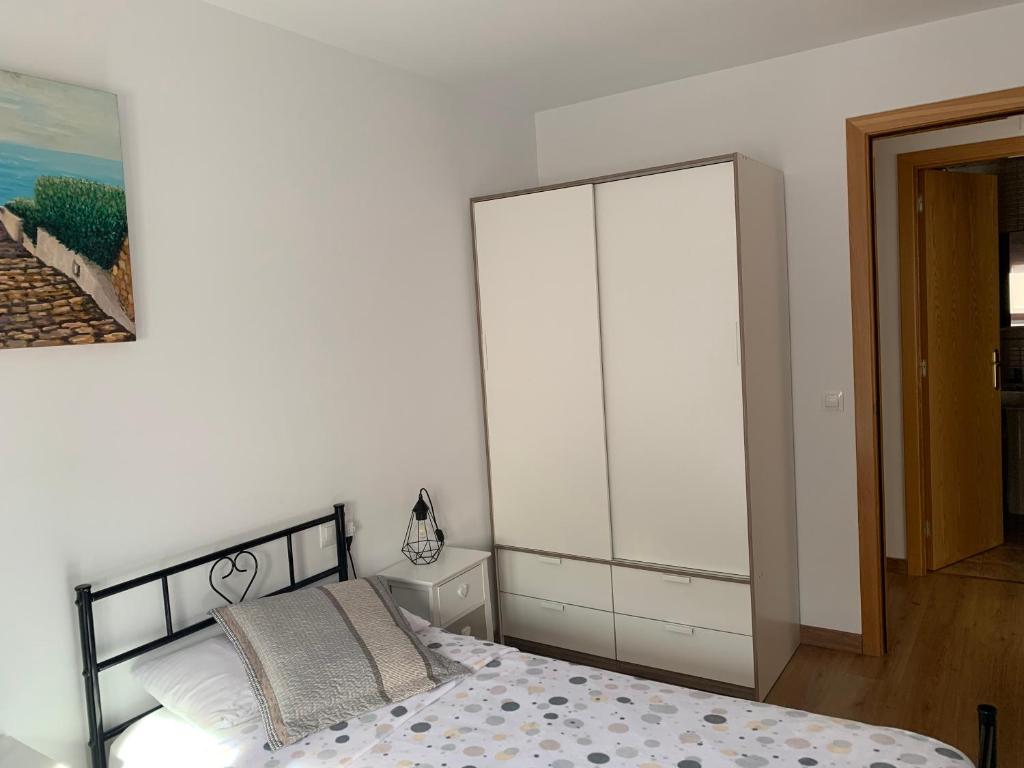Postel nebo postele na pokoji v ubytování Piso Victoria