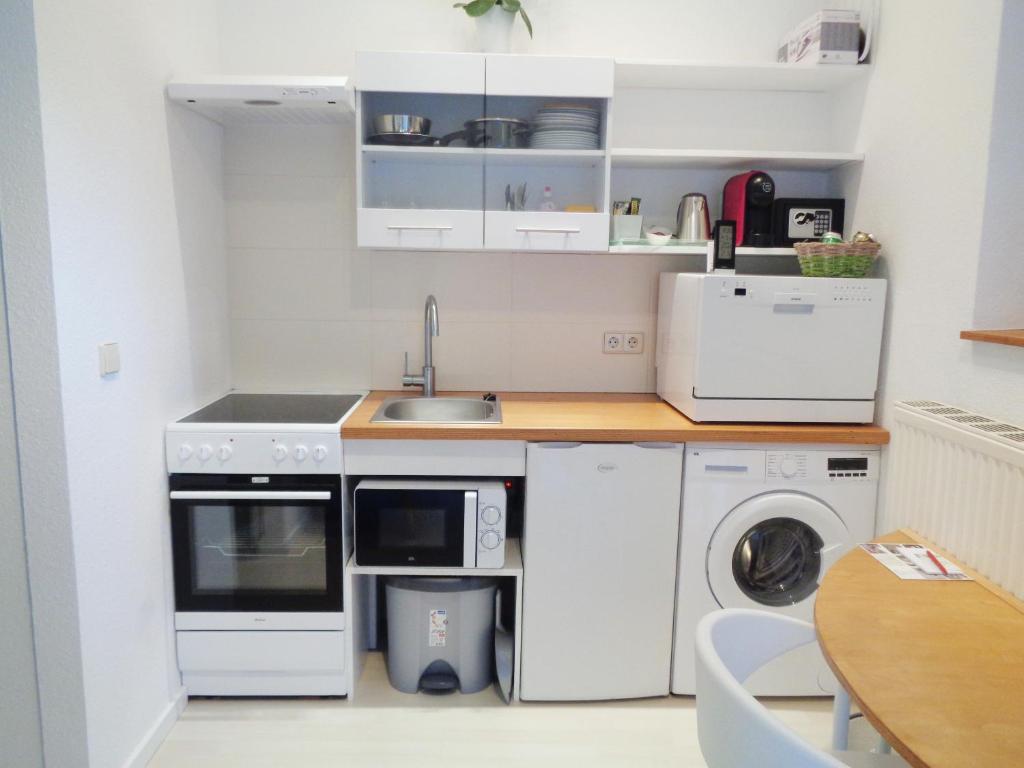 Kuchyň nebo kuchyňský kout v ubytování Hotel Apartment Puell