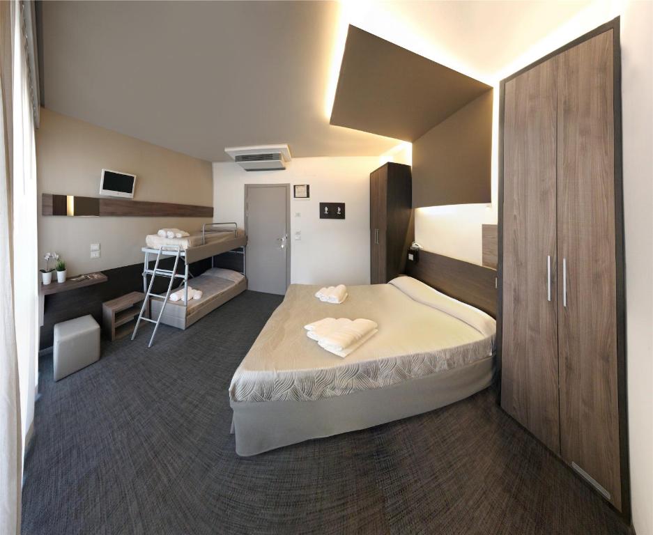 Postel nebo postele na pokoji v ubytování Hotel Continental & Residence