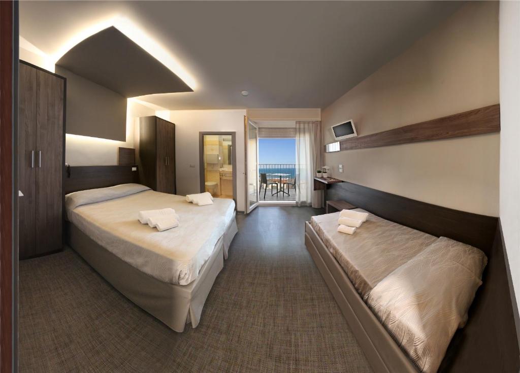 Postel nebo postele na pokoji v ubytování Hotel Continental & Residence