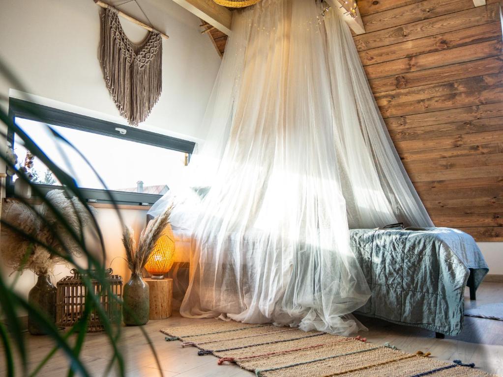 Posteľ alebo postele v izbe v ubytovaní Pod Mazurskim Niebem boho
